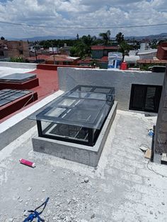 the roof of a building that is being constructed with concrete and glass on top of it