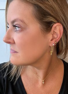 Introducing our 18k gold-plated Lock Drop Earrings - the perfect way to add a touch of boldness to your look. With an edgy design and lightweight feel, they're the ideal choice for anyone looking to make a statement that stands out from the rest. At just over an inch in length, these earrings are the perfect size to show off your daring side without being too overwhelming. Don't be afraid to stand out with these unique and stylish Lock Drop Earrings. Trendy Brass Earrings, Edgy Hypoallergenic Earrings For Gifts, Trendy Everyday Brass Earrings, Trendy Long Drop Jewelry With Matching Earrings, Trendy Long Drop Single Earring, Trendy Yellow Gold Drop Earrings, Edgy Everyday Metal Earrings, Trendy Pierced Linear Earrings As Gift, Trendy Gold Linear Earrings With Ear Wire