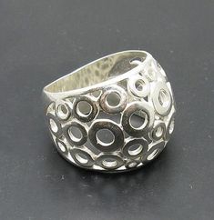 Sterling silver ring 925/1000. Circles band .Stamped 925. Approximate weight 7.3 grams. Top width 1.8cm . All our jewels are made from solid sterling silver 925/1000 and are carefully crafted by hand in our family workshop. We dispatch your orders in 5 working days, worldwide and the postage is $5. We ship registered priority mail. Please allow 5-7 working days for delivery in Europe and 10-15 working days outside Europe. For any questions - please do not hesitate to contact me! Sterling Silver Hallmarked Dome Ring, Sterling Silver Wide Band Ring Stamped 925, Silver Sterling Silver Dome Ring With Wide Band, Silver Hallmarked Dome Ring, Hallmarked Sterling Silver Wide Band Ring, Silver Sterling Dome Ring For Anniversary, Anniversary Sterling Silver Dome Ring, Silver Wide Band Jewelry Stamped 925, Silver Hallmarked Wide Band Ring