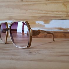 "Vintage woman unique sunglasses from the 70's. Oversized square beige frame with dark brown accents. Transparent lenses in gradient purple. Original high quality vintage from a new-old stock, never been used and in mint condition. Made in Italy. Also available in amber frame: https://www.etsy.com/listing/783459893/oversized-square-70s-tortoise-amber Measurements: Lens height: approx. 2.2\" / 5.7cm Lens width: approx. 2.1\" / 5.5cm Bridge: approx. 0.4\" / 1cm Arm length: approx. 4.8\" / 12.3cm T Vintage Sunglasses With Mirrored Glass Lenses, Retro Sunglasses With Uv Protection And Glass Material, Retro Sunglasses With Uv Protection And Glass Lenses, Retro Sunglasses With Uv Protection, Vintage Beige Sunglasses For Summer, Vintage Sunglasses With Gradient Glass Lenses, Retro Brown Adjustable Sunglasses, Vintage Sunglasses With Gradient Lenses And Adjustable Fit, Vintage Summer Aviator Sunglasses