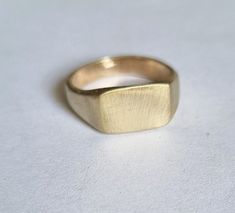 "Classic solid gold signet ring in a rectangular design, modern minimalist pinky ring jewelry for women, available in 9k, 14k, and 18k solid gold.  This handmade signet gold ring is elegant and classic. It was made by carving wax and casting it into gold.  It is available in 9k solid yellow gold, 14k solid yellow, white or rose gold, and 18k solid yellow gold, and in matte or shiny finish.  This ring is very comfortable to wear and great for everyday use, and will never go out of style. It can a Modern Gold Square Signet Ring, Classic Rectangular Signet Ring Stamped 14k, Square Classic Signet Ring For Formal Occasions, Square Minimalist Signet Ring For Formal Occasions, Minimalist Square Signet Ring For Formal Occasions, Classic Square Signet Ring For Formal Occasions, Formal Classic Square Signet Ring, Elegant Gold Square Signet Ring, Simple 14k Gold Signet Ring As Gift