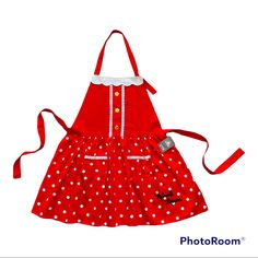 a red apron with white polka dots on it