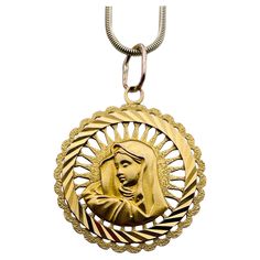 Large "Madonna" pendant/charm. The beautiful three-dimensional madonna is in the center, surrounded by a cut-out radiant border, a diagonal line border and an outer scalloped border. 18K yellow gold. 1 1/3" in diameter. A lovely luminous piece of jewelry. Alice Kwartler has sold the finest antique gold and diamond jewelry and silver for over forty years. Vintage Miraculous Medal Jewelry, Line Border, Scalloped Border, Diagonal Line, Jewellery And Watches, Pocket Watch, Madonna, Antique Gold, Gold Pendant