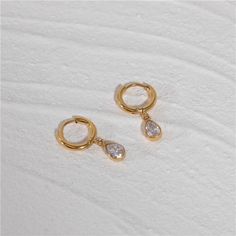 These sleek and elegant Sirena Earrings are perfect for both everyday wear and special occasions. ✅ Crafted from premium 5A grade zirconia, ensuring exceptional brilliance and durability. ✅ Meticulously manufactured using advanced techniques, guaranteeing precision and attention to detail in every aspect of design and construction. ✅ Made with hypoallergenic materials, these earrings are gentle on even the most sensitive skin, providing peace of mind and comfort for all-day wear. Elegant Silver Gold-plated Huggie Earrings, Elegant Teardrop Huggie Earrings Gift, Classic Gold Plated Diamond Earrings, Teardrop Hoop Earrings For Wedding, Tarnish Resistant, Teardrop Tarnish Resistant Hoop Earrings For Wedding, Modern Cubic Zirconia Earrings For Anniversary, Elegant Everyday Teardrop Hoop Earrings, Elegant Everyday Hoop Teardrop Earrings, Everyday Elegant Teardrop Earrings