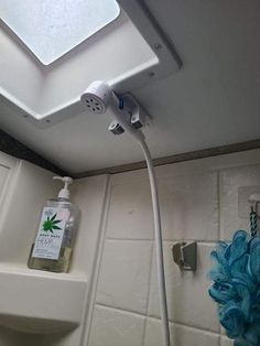 the shower head is plugged into the wall