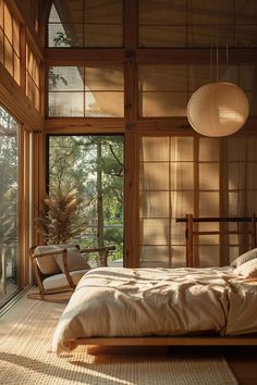 a large bed sitting in a bedroom next to a tall wooden wall with lots of windows