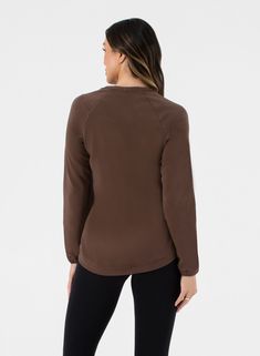 Discover the Sleek Sweat, where comfort meets style in the most luxurious way. This women's crew sweatshirt is crafted from buttery soft modal fabrication, providing an ultra-soft feel that you won’t want to take off. With its relaxed fit and classic crew neckline, the Sleek Sweat is designed for ultimate comfort while keeping you looking effortlessly chic. The high-low hem adds a modern touch, making this solid sweatshirt versatile enough for any occasion—dress it up for a night out or stay coz