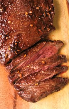 some meat is sitting on a cutting board