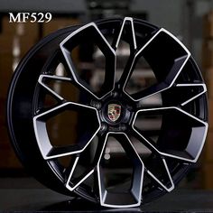 a wheel that is sitting on top of a black surface with the words mf529