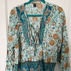 Woman’s Long Sleeve Tunic Top. Non Smoking House. Never Worn. Turquoise Floral Print Tops For Beach, Light Blue Bohemian Blouse With Floral Print, Bohemian Light Blue Floral Print Blouse, Bohemian Turquoise Top With Floral Print, Turquoise Bohemian Floral Print Top, Bohemian Turquoise Floral Print Top, Turquoise Long Sleeve Top For Summer, Light Blue Bohemian Blouse For Vacation, Bohemian Turquoise Long Sleeve Blouse