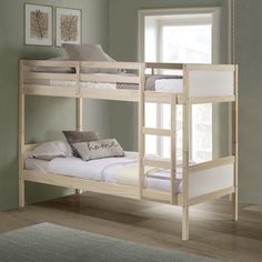 a bunk bed with two sets of mattresses on the bottom and one set below