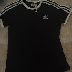 Black With White Stripes On Sleeve, Short Sleeve Adidas Black Tops With Three Stripes, Black Tops With Three Stripes For Spring, Black Cotton Top With Three Stripes, Black Cotton Tops With Three Stripes, Black Three Stripes Crew Neck T-shirt, Black Crew Neck T-shirt With Three Stripes, Casual Black T-shirt With Three Stripes, Black T-shirt With Three Stripes, Adidas Tshirt