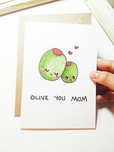 someone is holding up a card that says, birthday card for mom olive you mom