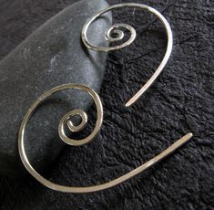 "These are our small open spiral hoop earrings, made from 20 gauge wire. Measures about 5/8\" diameter on the spiral and 1 1/8\" long We also offer a larger pair in our store. All of our jewelry will arrive boxed and ready to give as a gift. Made to order Larger pair crafted from 18 gauge... https://www.etsy.com/listing/62267488/open-spiral-hoop-earrings-handmade-from?ref=shop_home_active_3&frs=1 VISIT OUR SHOP: http://www.PoseidonsBooty.etsy.com SHOP POLICIES: http://www.etsy.com/shop/Posei Minimalist Spiral Hand Forged Jewelry, Minimalist Sterling Silver Swirl Earrings, Minimalist Spiral Hoop Earrings Handmade, Handmade Minimalist Spiral Hoop Earrings, Minimalist Handmade Spiral Hoop Earrings, Minimalist Spiral Earrings With Ear Wire, Minimalist Spiral Hoop Earrings In Sterling Silver, Minimalist Spiral Sterling Silver Hoop Earrings, Minimalist Spiral Nickel-free Earrings