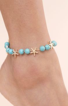 Online only! Enhance your beach style with Ettika's Starfish & Turquoise Beaded Anklet, adorned with turquoise beaded accents and playful starfish charms. This anklet adds a touch of coastal charm and bohemian elegance to your summer look.


	18k Gold Plated, Zinc, Reconstructed Turquoise
	8" with 1" extender
	Lobster Clasp Turquoise Starfish Beaded Bracelets, Ocean-inspired, Ocean-inspired Turquoise Starfish Beaded Bracelets, Turquoise Beaded Bracelets With Starfish Charm, Turquoise Ocean-inspired Bracelet With Starfish Charm, Ocean-inspired Turquoise Bracelet With Starfish Charm, Starfish-shaped Beaded Beach Jewelry, Starfish Shaped Beaded Bracelets For Beach Season, Bohemian Turquoise Starfish Beaded Bracelets, Blue Starfish Charm Anklet For Summer