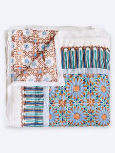 four pieces of cloth with different patterns and colors on the fabric, including one in blue