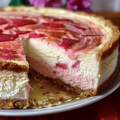 a cheesecake on a plate with one slice cut out and ready to be eaten