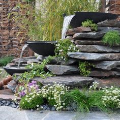 a water feature in the middle of a garden