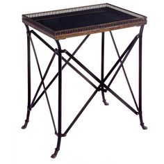 an iron and wood table with a black tray on the top, isolated against a white background