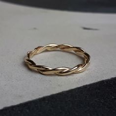 a gold ring sitting on top of a table