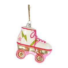 an ornament shaped like a roller skate with pink wheels and stars on it