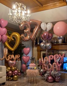 a room filled with lots of balloons and decorations