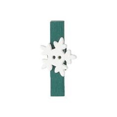 a white snowflake on a green wooden stick