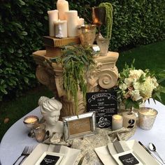 a table topped with plates and place settings