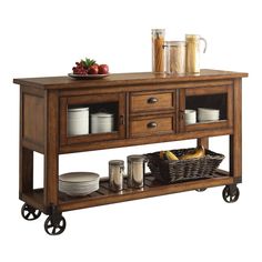 a kitchen island with drawers and plates on it