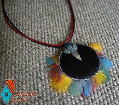 Beautiful necklace- pendant has been made from coconut decorated with Macau parrot natural feathers, Javali skin and Chryzocolla stone. adjustable circumference up to 58 CM Bohemian Feather Jewelry Gift, Adjustable Feather Necklace As Gift, Multicolor Feather Jewelry For Festivals, Macau Parrot, Parrot Feather, Coloured Feathers, Unique Pendant Necklace, Natural Jewelry, Hand Bracelet