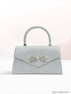 BagForLove - Silver Glitter Bow Top Handle Evening Bag - Elegant Satchel for Wedding Party Product Description Color Silver Details Rhinestone Magnetic Yes Strap Type Top Handle Pattern Type Plain Bag Size Small Closure Type Magnet Type Square Bag Material Glitter Composition 100% Polyester Size Chart INCH CM Bag Height Bag Length Bag Width Handle Height Strap Length 5.1 inch 9.1 inch 2.4 inch 3.5 inch 47.2 inch Bag Height Bag Length Bag Width Handle Height Strap Length 13 cm 23 cm 6 cm 9 cm 120 cm Details Pictures Similar Products h2 { text-align: center; } /* æ¢è¡ */ li{ white-space: normal; word-break: break-all; word-wrap: break-word; } .red-box { width: 100%; display: flex; flex-direction: row; flex-wrap: wrap; justify-content: center; } .red-box > div { width: 190px; height: 250px; Bow Top, Glitter Bow, Word Wrap, Square Bag, Silver Glitter, Evening Bags, Top Handle, 4 Inch, Wedding Party