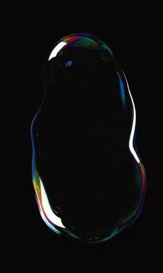 a soap bubble in the dark on a black background