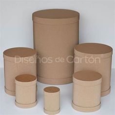 four round cardboard containers are shown on a white surface