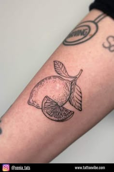 a black and white photo of a lemon tattoo