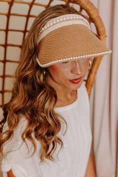 Stay protected from the sunshine while also staying stylish with this adorable tan visor featuring lightweight raffia material with delicate pearl trim detailing, an oversized brim, and an adjustable back! Chic Sun Hat With Uv Protection For Spring, Summer Sun Hat With Visor For Day Out, Summer Straw Visor Hat For Day Out, Summer Visor Sun Hat For Day Out, Summer Straw Hat Visor For Day Out, Summer Straw Hat With Visor For Day Out, Wide Brim Visor For Spring Vacation, Chic Straw Hat With Uv Protection For Spring, Summer Visor Straw Hat For Spring