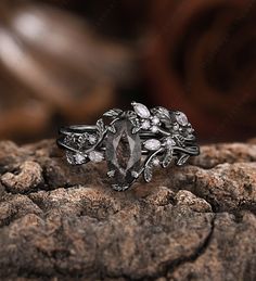 a diamond ring sitting on top of a rock