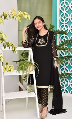 Description : Kameez (Shirt) :Black shirt with Embroidery Work and Lining Inside. Shalwar (Pants) : Jamawar/ Banarsi Trouser Dupatta (Scarf) :Black Dupatta. Country of Origin : Pakistan General Care Instruction : Should be washed in gentle cycle and hung to dry. Color may bleed so please be mindful of other items with it. General Disclaimer Size chart provides reference sizes and actual sizes might be slightly different from the size chart. Actual colors of the outfit may vary from the colors be Black Dupatta, Shoes Guide, Shirt With Embroidery, Eid Dress, Gala Design, Fancy Fashion, Girls Black Dress, Eid Dresses, Shalwar Kameez