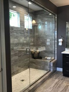 a walk in shower sitting next to a bathroom sink