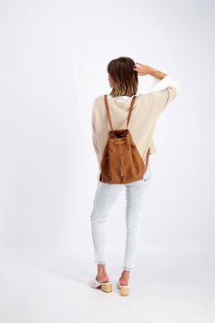 → DRAWSTRING BACKPACK ←Minimalist Everyday Women's Drawstring Backpack, Unique Women's Drawstring Backpack, Handcrafted by MAYKO, Laptop BackpackThis minimalistic MAYKO Leather Drawstring Backpack made out of 100% full-grain Italian Leather and is handcrafted from the first cut by high-class workmanship. The leather straps are adjustable by a metal buckle. It features one big compartment, fully cotton lining, an inside phone pocket, and a zipper pocket for your items, in the outside, there are t Grunge Backpack, Backpack Minimalist, Woman Backpack, Leather Gifts For Her, Minimalist Backpack, Brown Leather Backpack, Italian Leather Bags, Women Leather Backpack, Longchamp Le Pliage Backpack