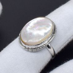 Welcome to your Shop Shop Link : https://uniquejewelstudio.etsy.com Stone: Mother Of Pearl Gemstone Shape: Oval Shape Ring Size:- All Size Ring Weight : 3 to 8 gm Metal:- Pure 925 Sterling Silver Jewelry Type:- Ring Stock Code : SR-1026 Benefits of Mother's Of Pearl, Wearing Mother Of Pearl as jewelry is beneficial to the soft tissue, muscle tissue, heart, and joints. It will help you connect with the power of water, providing calming and subtle energy. This will help to guard you against negati White Pearl Ring Stamped 925 As Gift, Handmade Classic Pearl Ring As A Gift, Handmade Classic Pearl Ring For Gift, Handmade Classic Pearl Ring As Gift, Handmade Silver Ring For Birthday, Silver Oval Ring For Birthday, Handmade Oval Pearl Ring For Anniversary, Birthday Sterling Silver Rings Stamped 925, White Gold Oval Pearl Ring As Gift