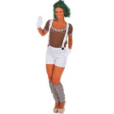 a woman dressed in an adult sized costume with green hair and suspenders, holding her hand up to the side