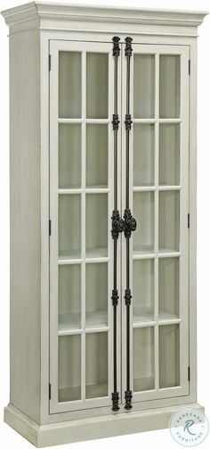 a white bookcase with glass doors and black handles