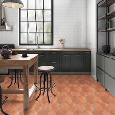 a kitchen with an orange tile floor and counter tops, along with two stools