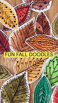 an image of fall doodles on a wooden table with the words fun fall doodles