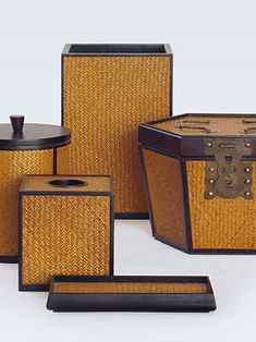 an assortment of brown and black baskets with lids on them, including one for the trunk