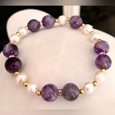 Gorgeous 10mm Amethyst Beads & 7-8mm White Freshwater Pearl With Gold Rhinestone Spacers Stretch Bracelet. Measures 7.5” Inches. New Condition And Comes In A Dust Pouch. Bundle & Save: Bundle 2 Or More Items For A Private Discount Next Day Shipping On All Orders 5 Star Rated Poshmark Ambassador Elegant Amethyst Rondelle Beaded Bracelets, Elegant Amethyst Crystal Bracelet With 8mm Beads, Elegant Purple Rondelle Beaded Bracelets, Elegant Round Amethyst Beaded Bracelets, Elegant Amethyst Beaded Bracelets, Elegant Purple Beaded Bracelets With Stones, Elegant Hand-strung Amethyst Beaded Bracelets, Elegant Purple Rondelle Bracelets, White Amethyst Beaded Gemstone Bracelets