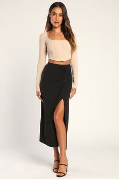 Chic pieces like the Lulus Simply in Style Black Twist-Front Slit Midi Skirt never go out of style! Stretchy knit fabric shapes this go-to skirt that has a banded waist with a twisted detail at the side, finishing at a midi hem with an alluring side slit. Pair with boots and a cute top and you'll have a perfect 'fit for cooler days! Fabric: Fabric is very stretchy. Unlined. 80% Polyester, 20% Spandex. Hand Wash Cold. Do Not Bleach. Line Dry. Iron Low Heat. Imported. Lulus | Simply in Style Black Black Midi Skirt Outfit, Midi Black Skirt, Bday Dress, High Waisted Black Skirt, Twisted Skirt, Black Skirt Outfits, Friend Canvas, Legs Outfit, Clothes Making