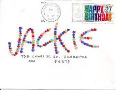 an envelope with the words happy birthday on it