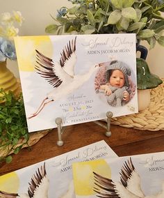 three cards with pictures of two birds and a baby in a hat on top of a table