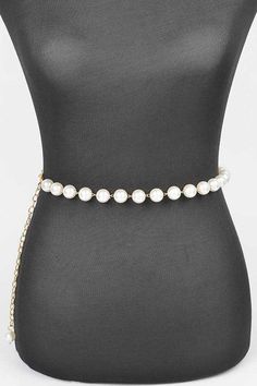 Accentuate your style with the Pearl Station Iconic Chain Belt. This elegant accessory features a chain design adorned with delicate pearls, adding a touch of sophistication to any outfit. Elevate your wardrobe with this iconic and versatile piece. One Size / AdjustableWidth - 0.65"Length - 47"Composition - PVC, Lead & Nickel Compliant